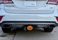 A Jack-O-Lantern Hitch Insert in a Car.