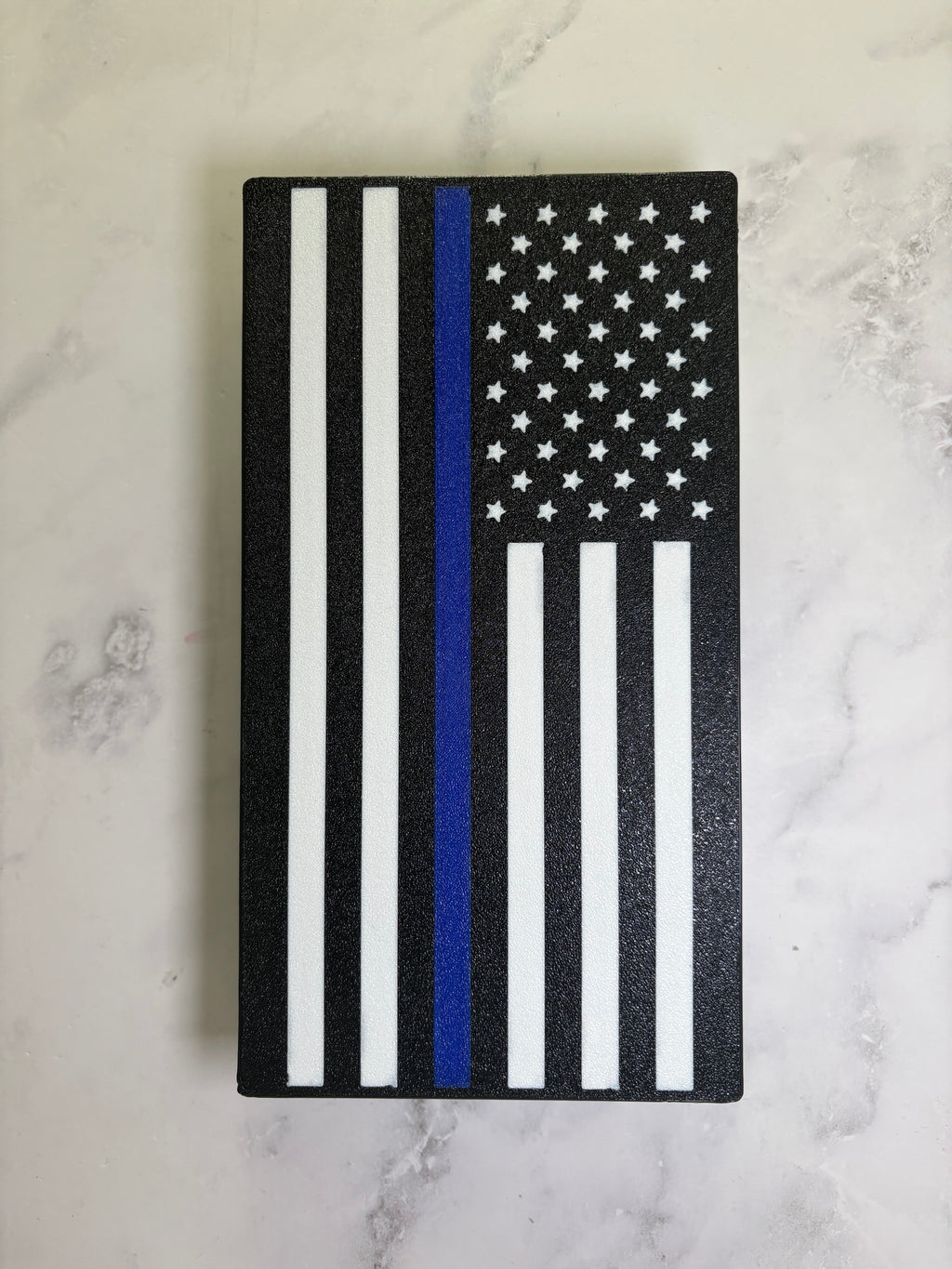 Thin Blue Line flag hitch cover front view showing the textured black finish and white stars