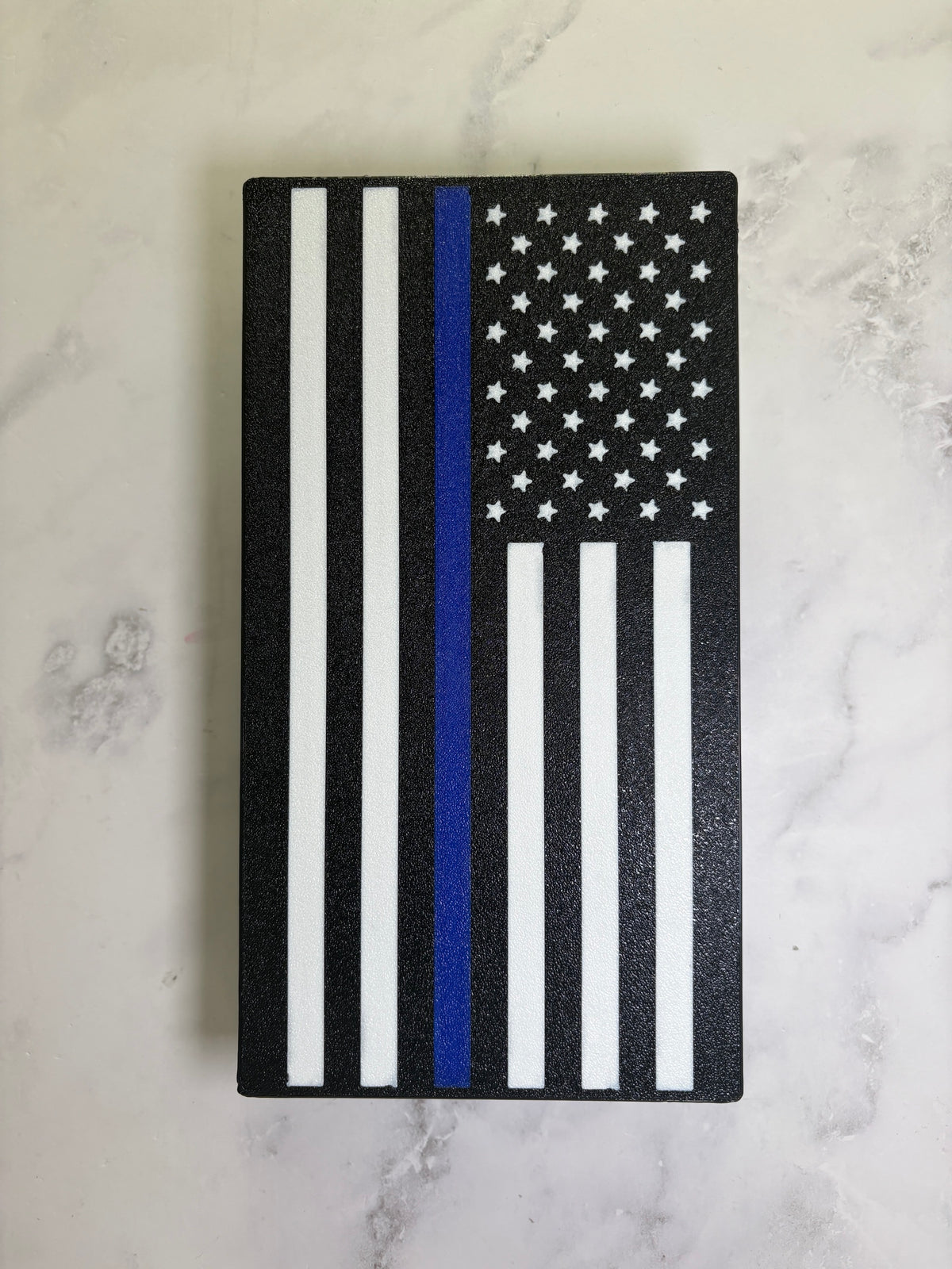 Thin Blue Line flag hitch cover front view showing the textured black finish and white stars