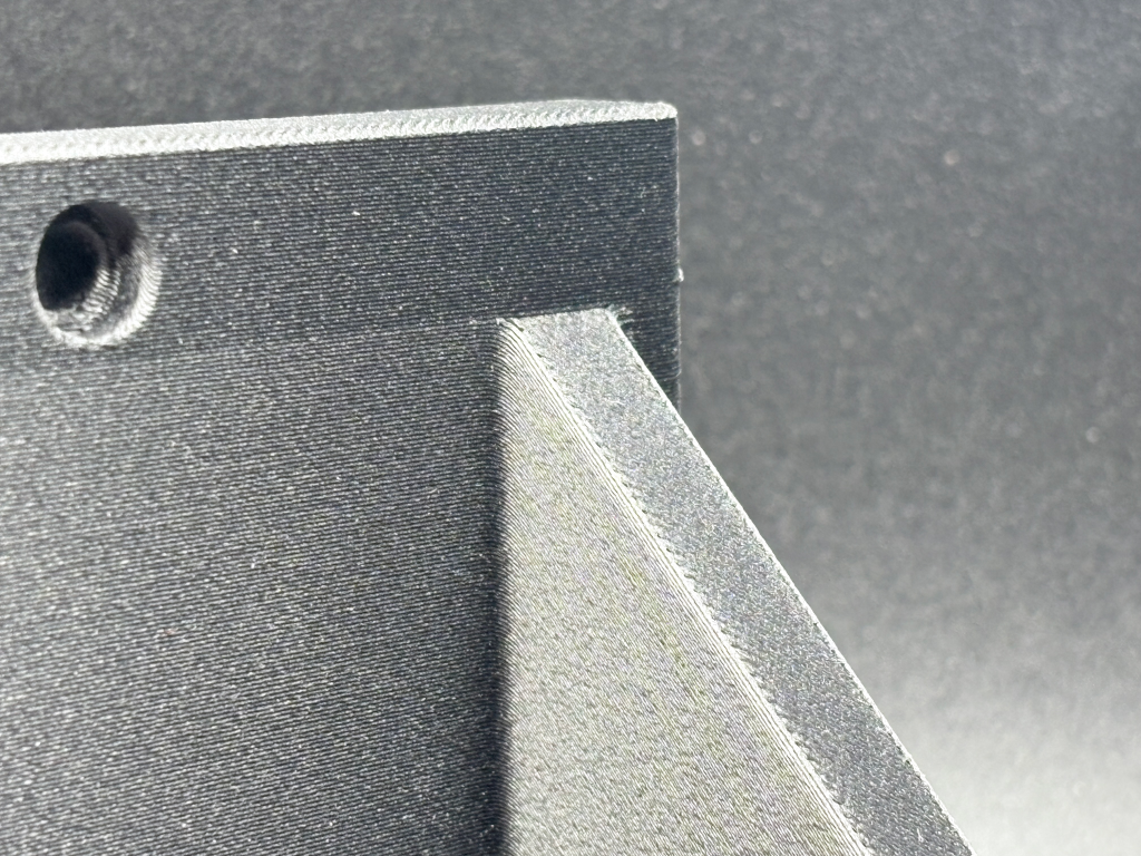 An up Close Picture of an Item printed in PA12-CF